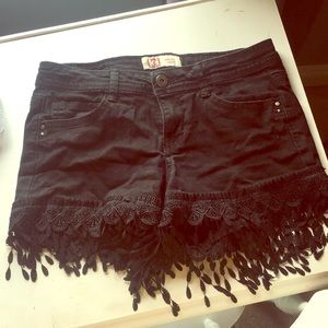 Black shorts with fringe